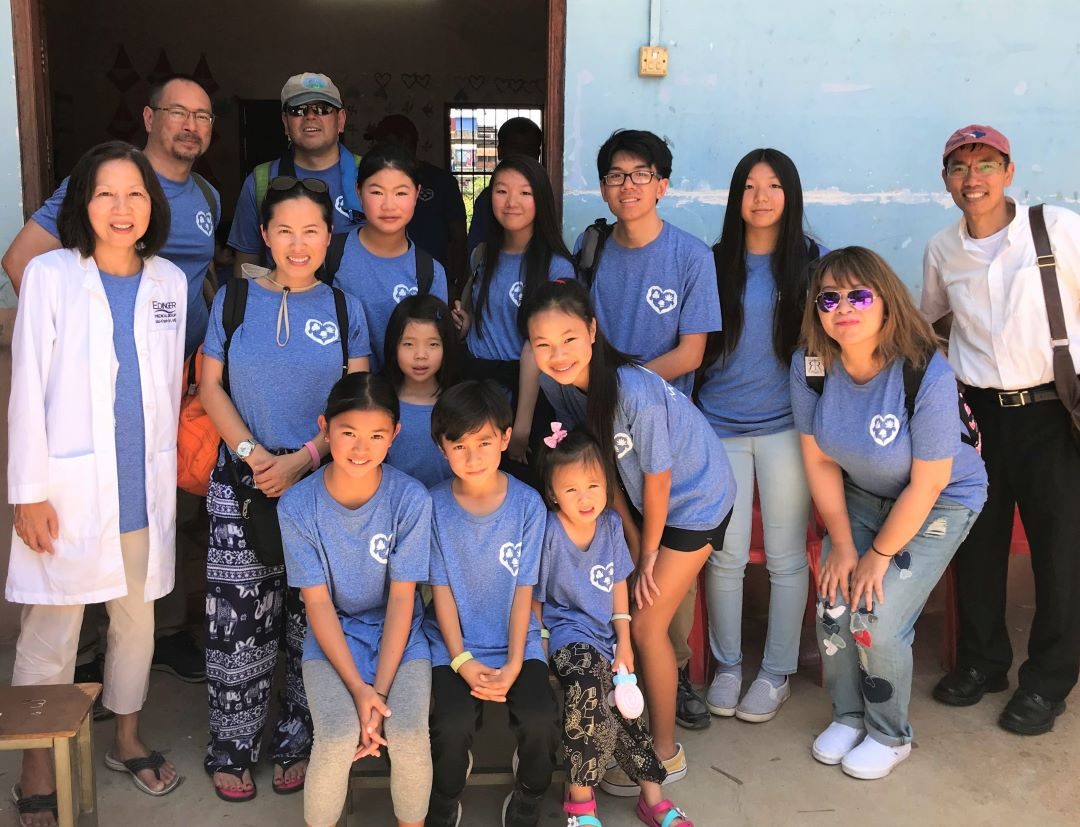 The IHM team during a Cambodia mission trip — doctors, volunteers, and family members serving together
